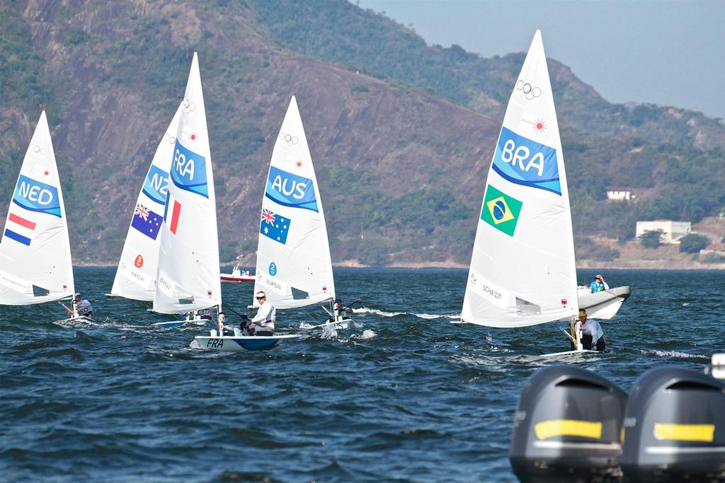 The spread fleet makes the medal change at the finish of the Mens Laser Medal Race- 2016 Sailing Olympics photo copyright Richard Gladwell www.photosport.co.nz taken at  and featuring the  class