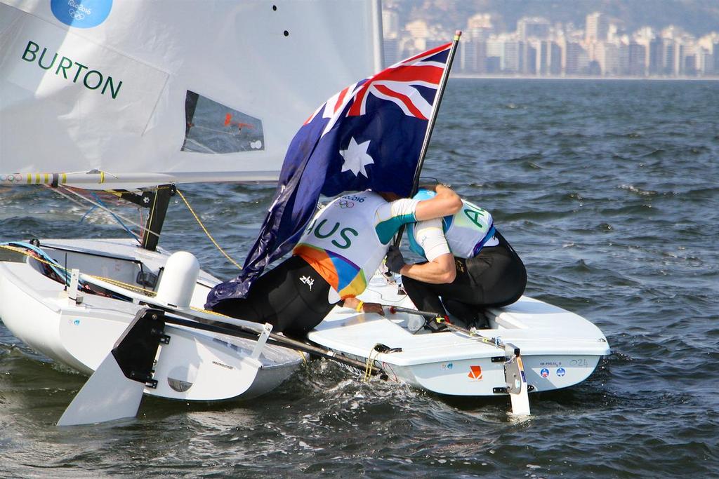 Tom Burton (AUS) is congratulated by fellow Australian Sailing Team member Jake Lilley on his way out to compete in the Finn class medal Race - 2016 Olympics photo copyright Richard Gladwell www.photosport.co.nz taken at  and featuring the  class
