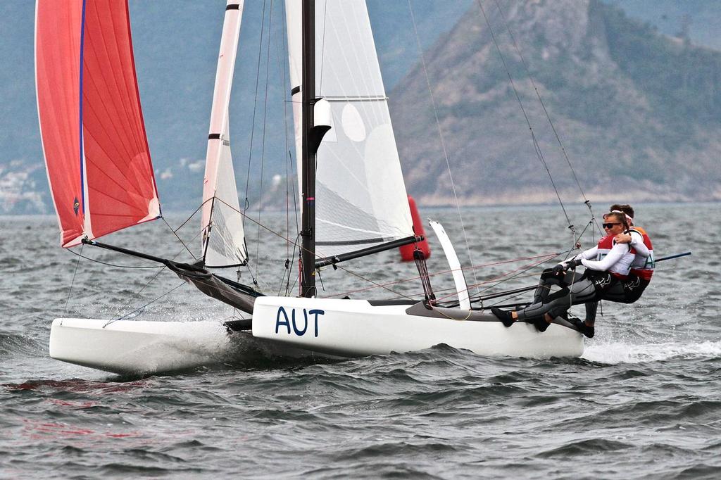 Thomas Zajac and Tanja Frank about to cots the finish line and take the Bronze medal in the Nacra 17 Medal race. Summer Olympics photo copyright Richard Gladwell www.photosport.co.nz taken at  and featuring the  class