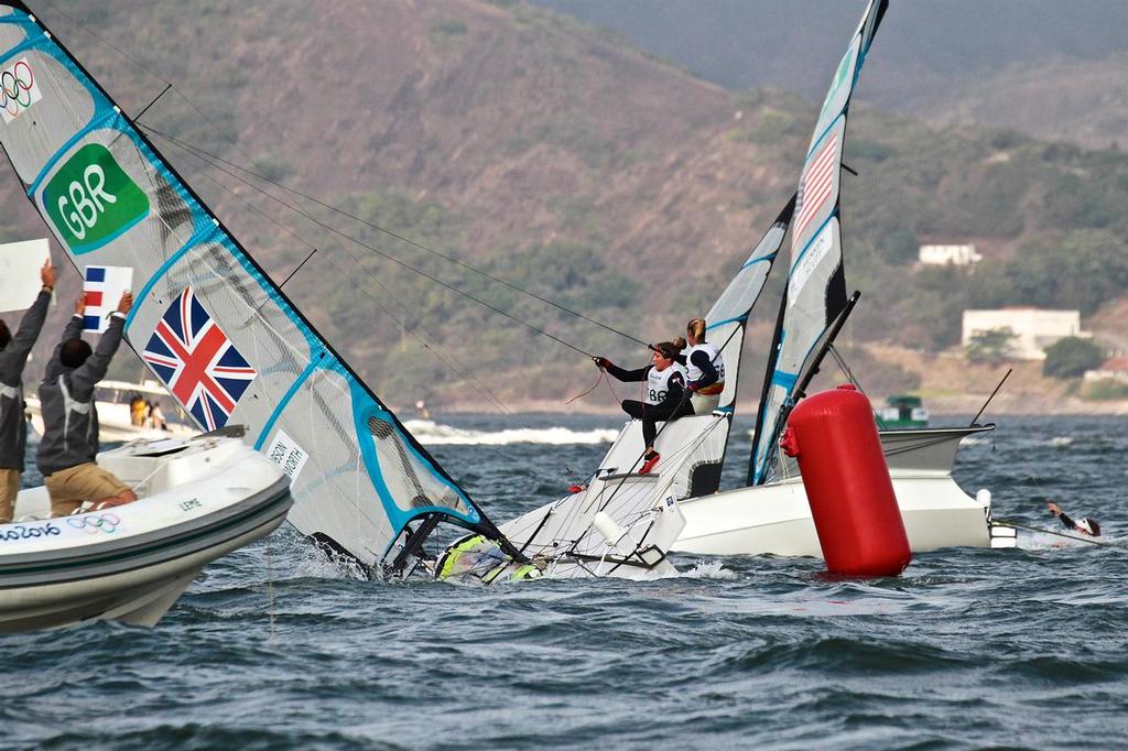 USA starts the capsize and GBR follows - Leg 2, 49erFX Medal race - 2016 Sailing Olympics photo copyright Richard Gladwell www.photosport.co.nz taken at  and featuring the  class