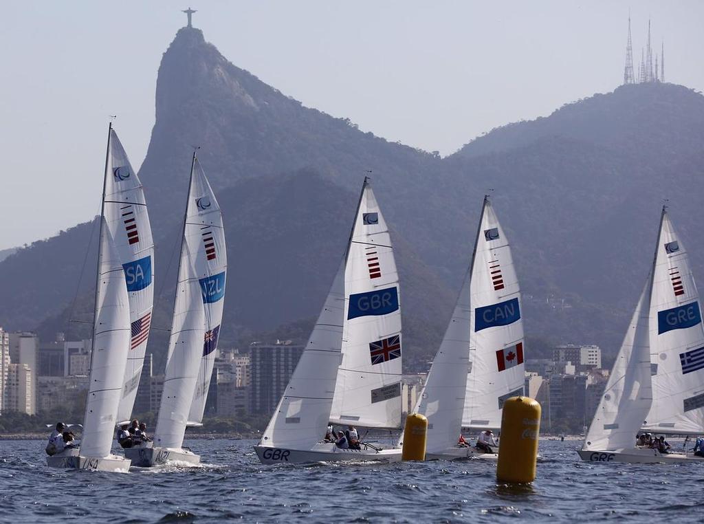 Kiwis chase the US crew in race 2 of the Sonar - 2016 Paralympics - Day 1, September 13, 2016 photo copyright Richard Langdon / World Sailing taken at  and featuring the  class