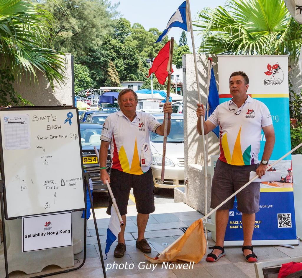 And then the P goes up... ARO Josef Roels (l) and RO Dave Norton (r) demonstrate the semaphore system at Race Briefing. Bart's Bash 2016 by Sailability HK.  © Guy Nowell http://www.guynowell.com