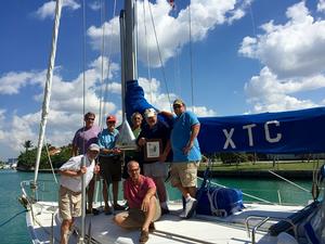 The crew of XTC pose with their trophy for first place in Class A  following the first Pensacola a La Habana Race. XTC is a Beneteau OC 461, owned by Tom Glew, St. Petersburg FL photo copyright Photo courtesy of XTC taken at  and featuring the  class