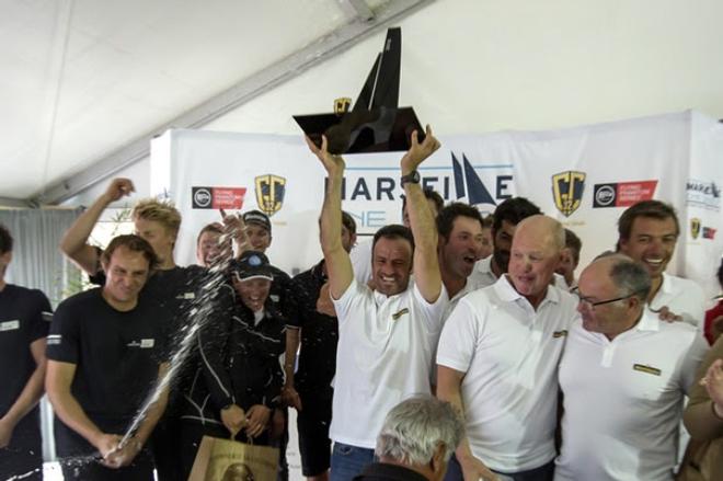 Franck Cammas and crew accept the winner's spoils. - GC32 Racing Tour - 16 October 2016 © Sander van der Borch / Bullitt GC32 Racing Tour