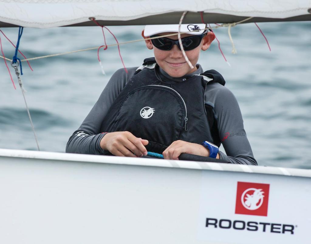 It's that 'Usain Bolt moment'. Duncan Gregor heads for a win and still has time to smile for the camera! HK Optimist National & Open Championships 2016.   © Guy Nowell / HKODA