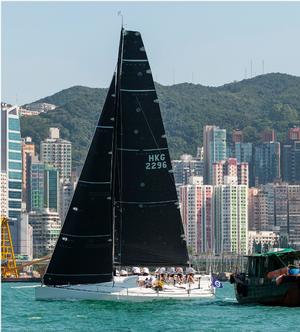 Black Baza and a fishing boat - Volvo Hong Kong to Hainan Race photo copyright  RHKYC/Guy Nowell http://www.guynowell.com/ taken at  and featuring the  class