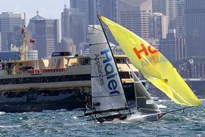 Haier Appliances and the Manly Ferry on an otherwise boat free harbour photo copyright Frank Quealey /Australian 18 Footers League http://www.18footers.com.au taken at  and featuring the  class