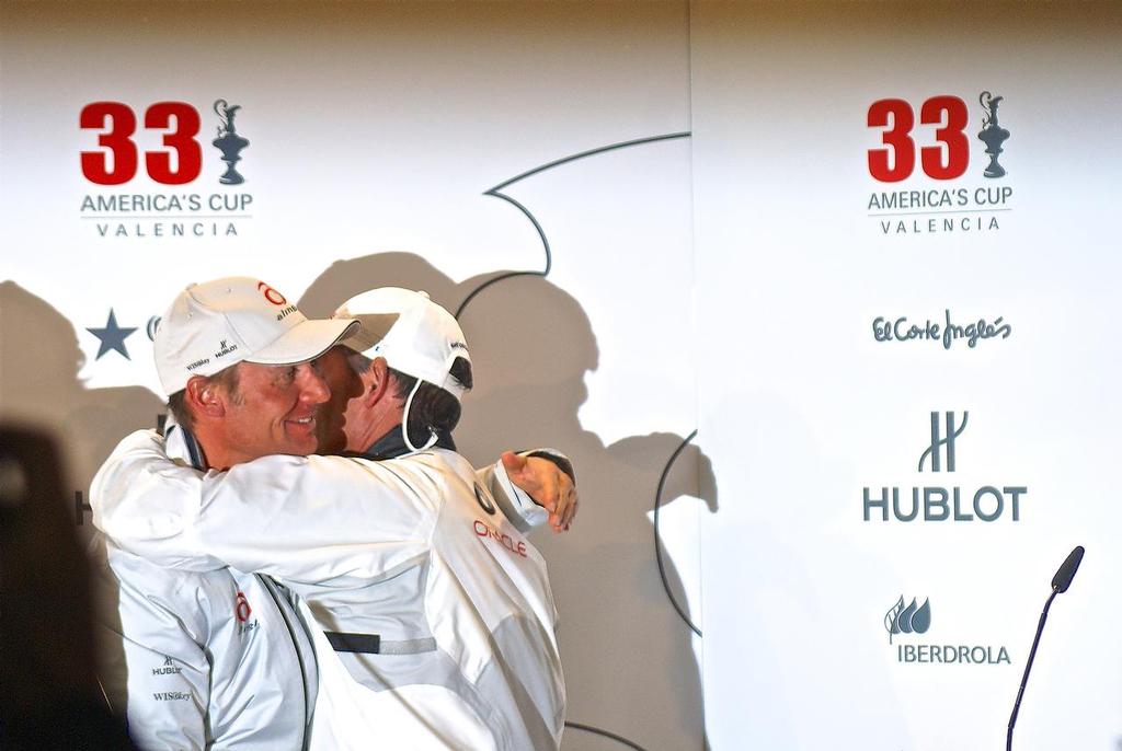 Russell Coutts embraces his former team boss Ernesto Bertarelli at the America's Cup handover media conference in Valencia in February 2010 photo copyright Richard Gladwell www.photosport.co.nz taken at  and featuring the  class