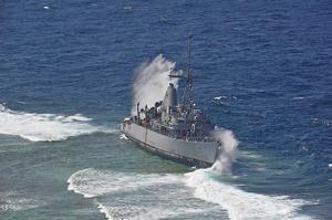 USS Guardian getting smashed by waves over Tubbataha Reefs. photo copyright US Navy taken at  and featuring the  class