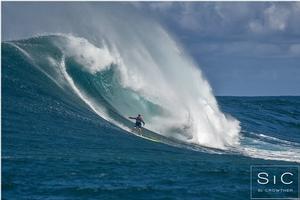 Paige Alms, Deep2Peak athlete, on her way to the first ever Women's Peahi Challenge first place finish - NoveNove Maui Aloha Classic photo copyright  Si Crowther / IWT taken at  and featuring the  class