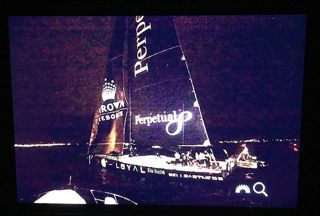 Perpetual Loyal crosses the line to smash the record. Crosby Lorimer displays one of his images on the LCD of his DSLR camera - Rolex Sydney Hobart Yacht Race © Crosbie Lorimer http://www.crosbielorimer.com