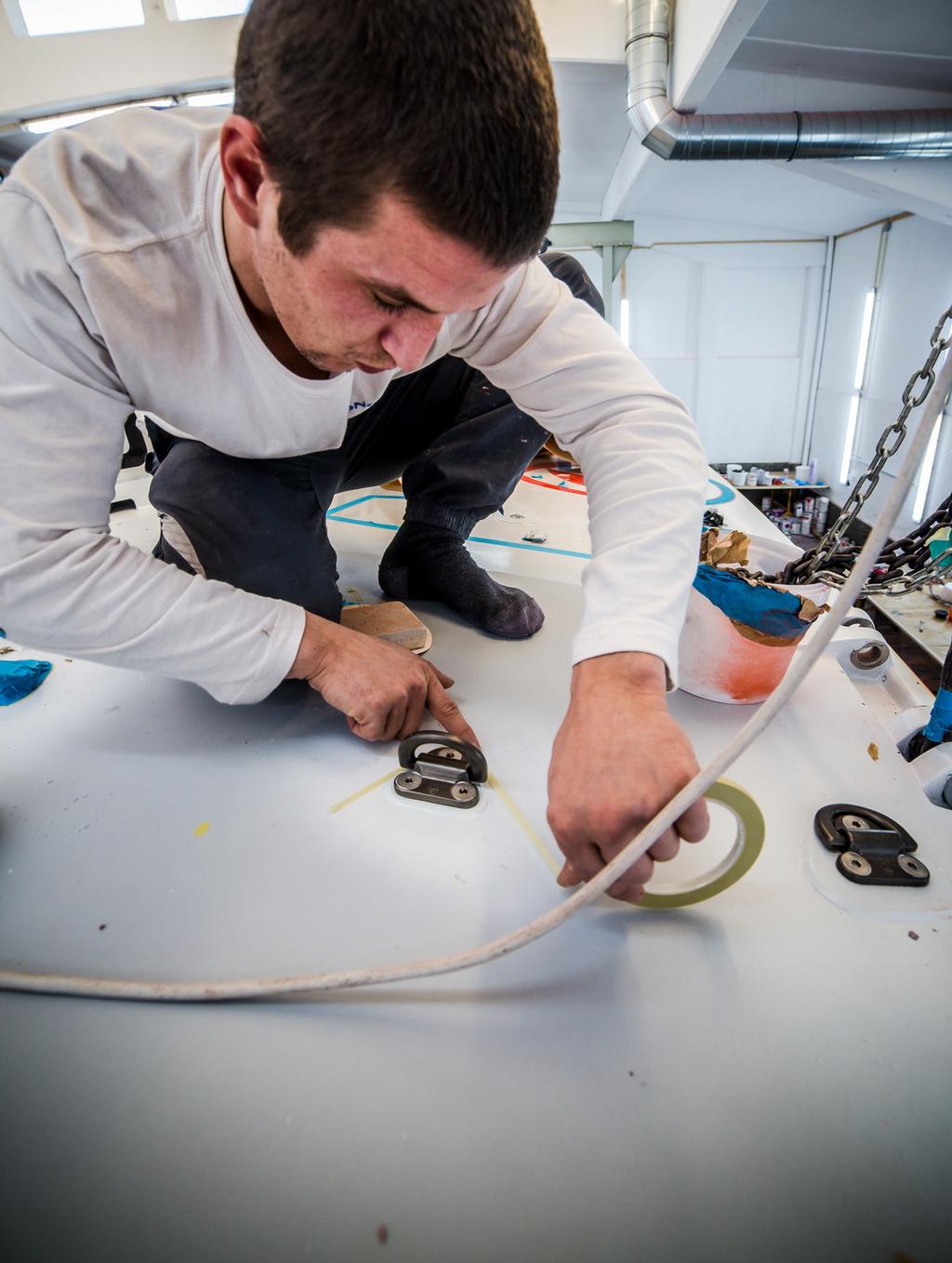 Boat One, Dongfeng getting the final retouches after being clear coated. ©  Amalia Infante / Volvo Ocean Race