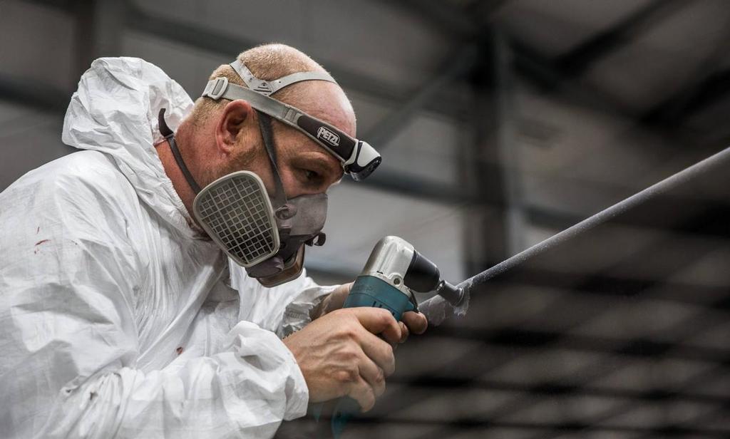 Boat Builder Ian Boag putting in the final touches to T3 - Land Rover BAR, December 2016 Bermuda &copy; Alex Palmer