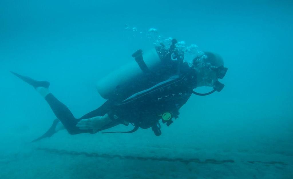 Shore team's Graham Goff checks out the MDL Marinas pontoon system - Land Rover BAR, December 2016 Bermuda &copy; Alex Palmer
