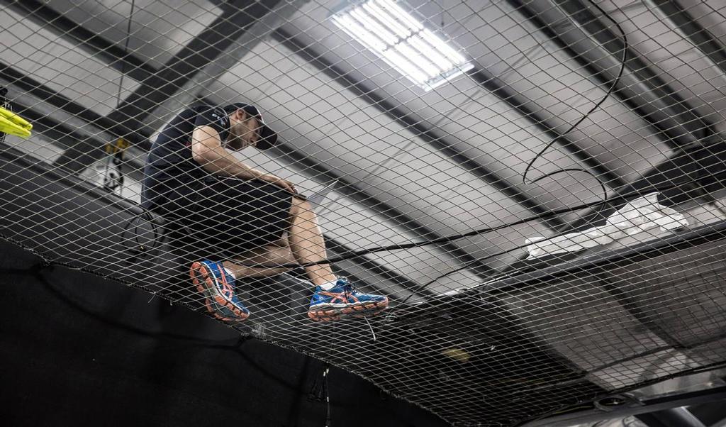 Sailing team member Andrew McLean doing the system checks on T3 ahead of her first sailing day in Bermuda - Land Rover BAR, December 2016 Bermuda &copy; Alex Palmer