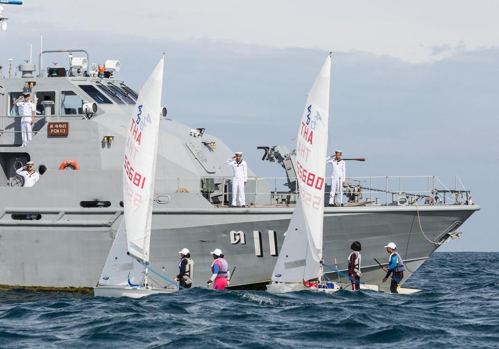 All stand. 420s sail past. Phuket King's Cup 2016. © Guy Nowell / Phuket King's Cup