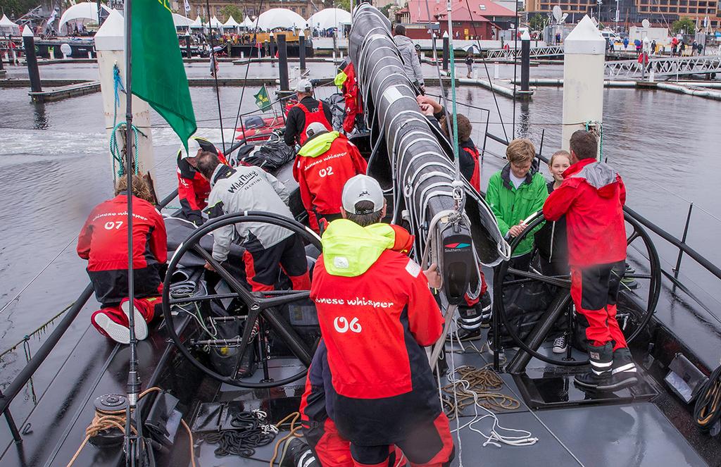 The Chinese Whisper team tidies up while skipper Rupert Henry catches up with his children. photo copyright Crosbie Lorimer http://www.crosbielorimer.com taken at  and featuring the  class