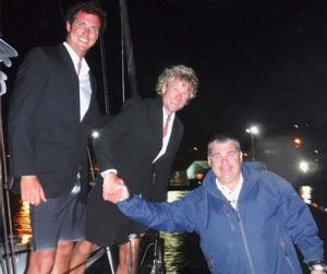 Finishing in style wearing DJs: James Heald and Ben Harris completed the 3,000 nmile race from Lanzarote to Grenada in the early hours of Thursday 15 December and were greeted on the dock at Camper and Nicholsons Port Louis Marina by Marina Manager, Glynn Thomas and Louay Habib, RORC Media Reporter - RORC Transatlantic Race photo copyright Louay Habib / RORC taken at  and featuring the  class