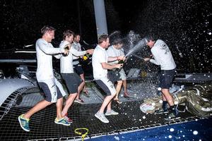 Champagne celebrations on Phaedo3 photo copyright RORC/Arthur Daniel taken at  and featuring the  class