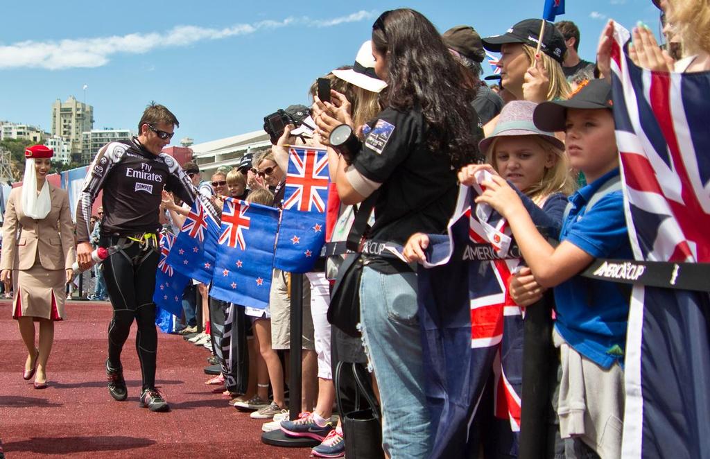 Emirates Team New Zealand skipper, Dean Barker, shakes hands with fans during the dock out show, on day one of the 2013 Louis Vuitton Cup final between Emirates Team New Zealand and Luna Rossa. © Bob Grieser/Outside Images www.outsideimages.com