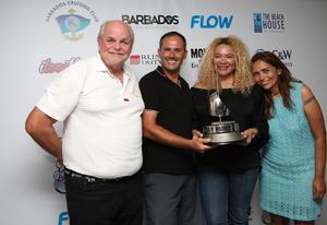 Andreas Berg won 88kg worth of Mount Gay Rum for smashing the Round Barbados Singlehanded record aboard his Dufour 44 – Luna. (from left) Howard Palmer – chairman of the MGRBR committee, Andreas Berg, Petra Roach (BTMI), and Alene Dholakia  – event manager. - Mount Gay Round Barbados Race Series photo copyright Nigel Wallace / MGRBR taken at  and featuring the  class