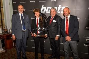 Elliott Kuzyk receives the boats.com YJA Young Sailor of the Year trophy from Ian Atkins, chairman of boats.com . Left to right: Barry Pickthall, Elliott Kuzyk, Ian Atkins; Ian Walker, last year's Yachtsman of the Year winner. photo copyright Sam Kurtul taken at  and featuring the  class