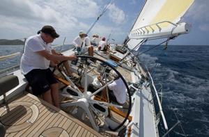 Racing at Antigua Sailing Week last year, Roland Pieper at the helm of Kialoa III - one of the most well known of  Jim Kilroy's Maxi yachts - RORC Caribbean 600 photo copyright Digby Fox taken at  and featuring the  class