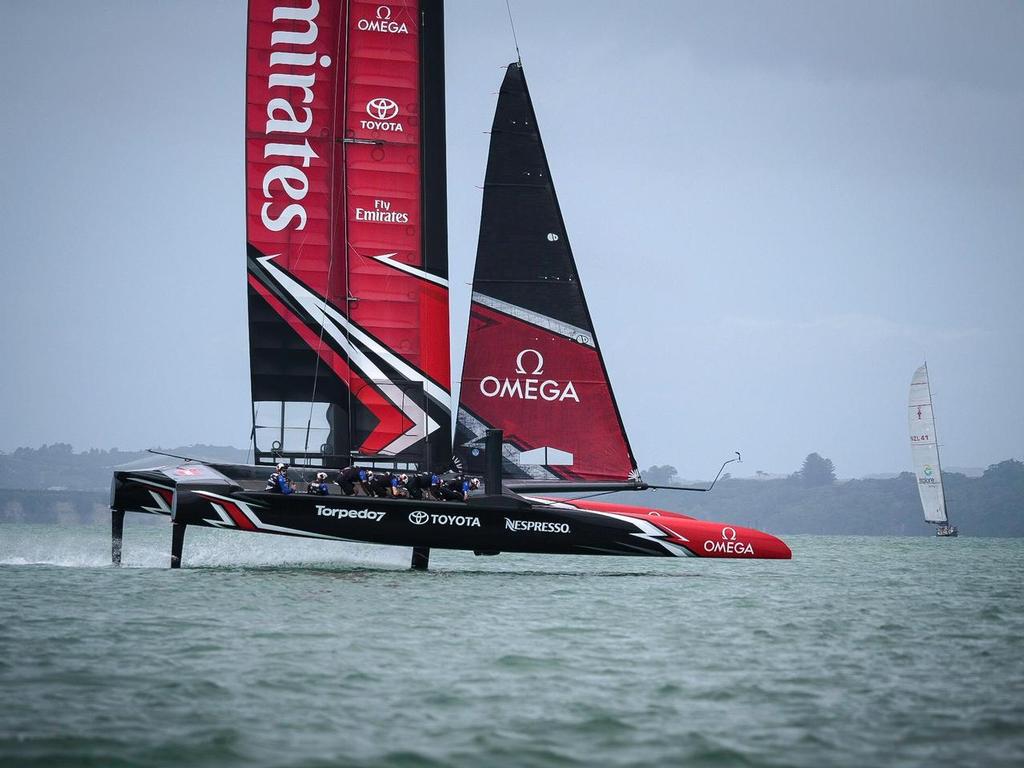 Emirates Team NZ's AC50 in fast mode - bow down, rudder foils out, slight heel to windward, and cycling team grinding photo copyright Hamish Hooper/Emirates Team NZ http://www.etnzblog.com taken at  and featuring the  class