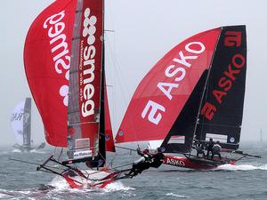Asko Appliances narrowly crosses Smeg on the first run - 18ft Skiffs - JJ Giltinan Championship 2017 photo copyright 18footers.com taken at  and featuring the  class