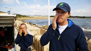 Emmett Lazich and Nathan Outteridge applying sunscreen before sailing photo copyright Beau Outteridge / Australian Sailing taken at  and featuring the  class