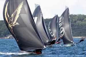 Triple M leads a group of skiffs off Clark Island - JJ Giltinan 18ft Skiff Championship photo copyright Frank Quealey /Australian 18 Footers League http://www.18footers.com.au taken at  and featuring the  class