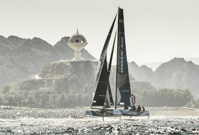 The fleet racing close to the shore and historic town of Mutrah - Extreme Sailing Series © Lloyd Images http://lloydimagesgallery.photoshelter.com/