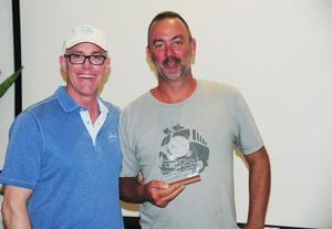 Norwood Smith, Vice President, Sales and Marketing, Scrub Island Resort, Spa and Marina presents Matt Barker's classic yacht, The Blue Peter with a beautiful trophy for second in CSA cruising – BVI Spring Regatta and Sailing Festival photo copyright Todd VanSickle taken at  and featuring the  class