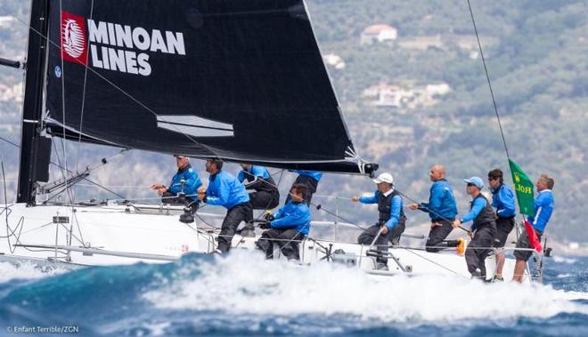 Skipper Alberto Rossi, holding tiller, has Enfant Terrible atop the leader board after two days of racing at Rolex Capri Sailing Week. Enfant Terrible has won two races. © Enfant Terrible/ZGN