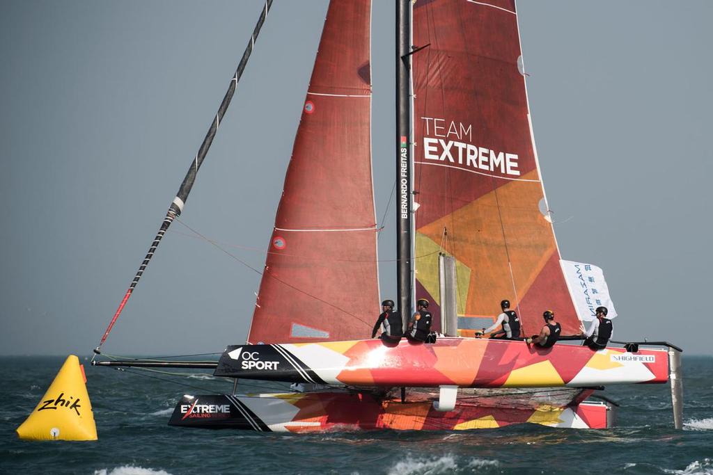 Tom Buggy on his foiling wakeboard behind a foiling GC32 catamaran ©  Xaume Olleros / OC Sport