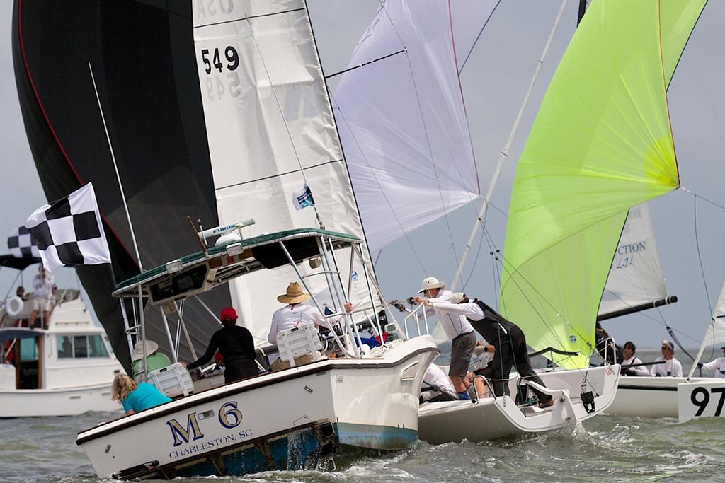 Anchors Aweigh! A J/70 and its crew get tangled up with the anchor line of a race committee boat during the finish of the final contest at Sperry Charleston Race Week. Only their pride was injured! © Meredith Block/ Charleston Race Week http://www.charlestonraceweek.com/