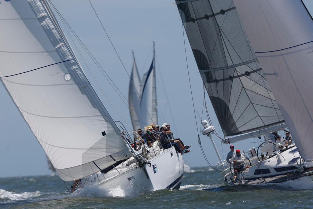 Steve Lesniak's Charleston-based Beneteau 510 (left) and the rest of the boats racing in the Pursuit Class may not be sailing windward-leeward America’s Cup courses, but they’re racing for glory as they put the pedal down in big breeze during Day 2 of Sperry Charleston Race Week 2017. © Tim Wilkes / Charleston Race Week