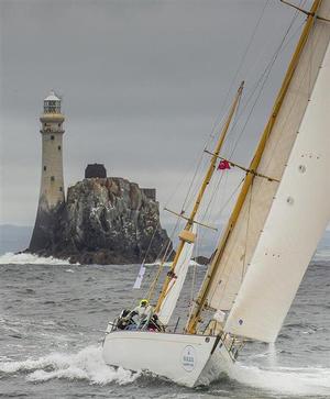 The 52-foot American yawl, Dorade - two-time winner of the Fastnet Race in the 1930s - rounding legendary Fastnet Rock during the 2015 Rolex Fastnet Race. photo copyright  Rolex/Daniel Forster http://www.regattanews.com taken at  and featuring the  class
