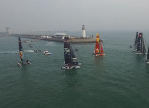 2016 Act 2, Extreme Sailing Series Qingdao – Aerial photo of the fleet in Fushan Bay – The fleet will compete in open water racing on day one followed by Stadium Racing in Fushan Bay on the remaining days, a stadium venue notorious for its temperamental weather. photo copyright  Z-Drones taken at  and featuring the  class