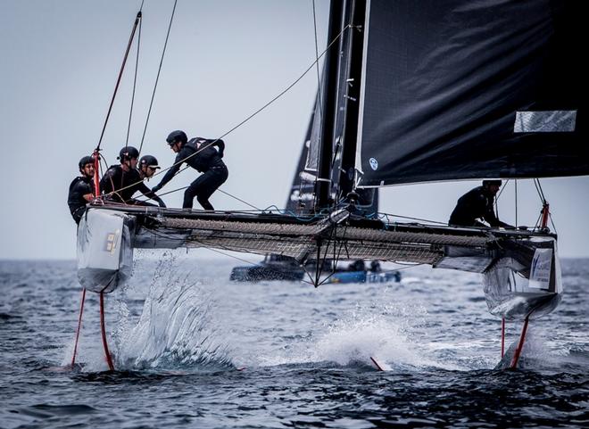 Day 3 – Charging downwind demands big work from the crew at the GC32 Villasimius Cup © Jesus Renedo / GC32 Racing Tour