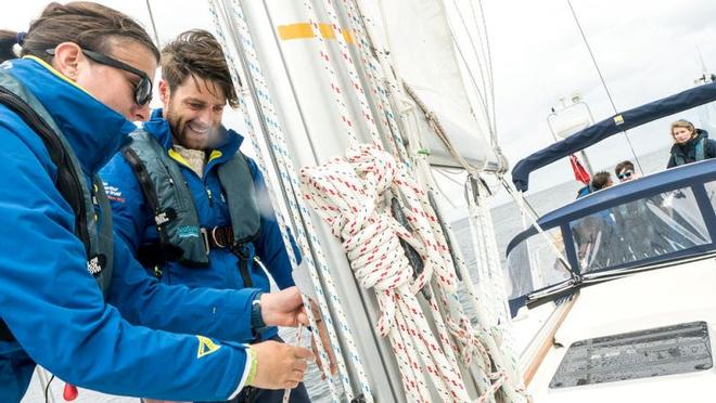 Luke learning the ropes on Moonspray with Mate Hannah Spencer – Hannah first sailed with the Trust as a young person in recovery from cancer seven years ago. She is now doing the full four month Round Britain 2017 voyage as Mate onboard. © Ellen MacArthur Cancer Trust
