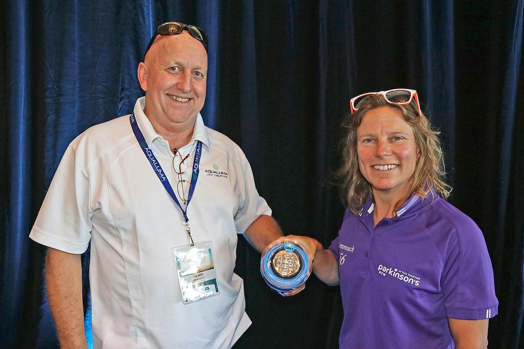 Carl Amor from Aqualuma presents Poppy with one of the lights he and brother Grant donated to her cause. photo copyright  John Curnow taken at  and featuring the  class