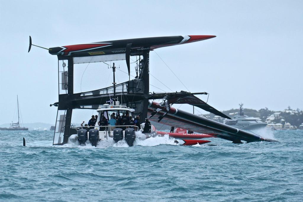 Emirates Team New Zealand is manoeuvred into a position where  she can be righted - Semi-Final, Day 11 - 35th America's Cup - Bermuda  June 6, 2017 photo copyright Richard Gladwell www.photosport.co.nz taken at  and featuring the  class