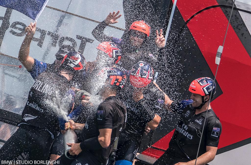 Emirates Team New Zealand crew turn on the champagne fire-hose after winning the 35th America's Cup - photo © BMW | Studio Borlenghi