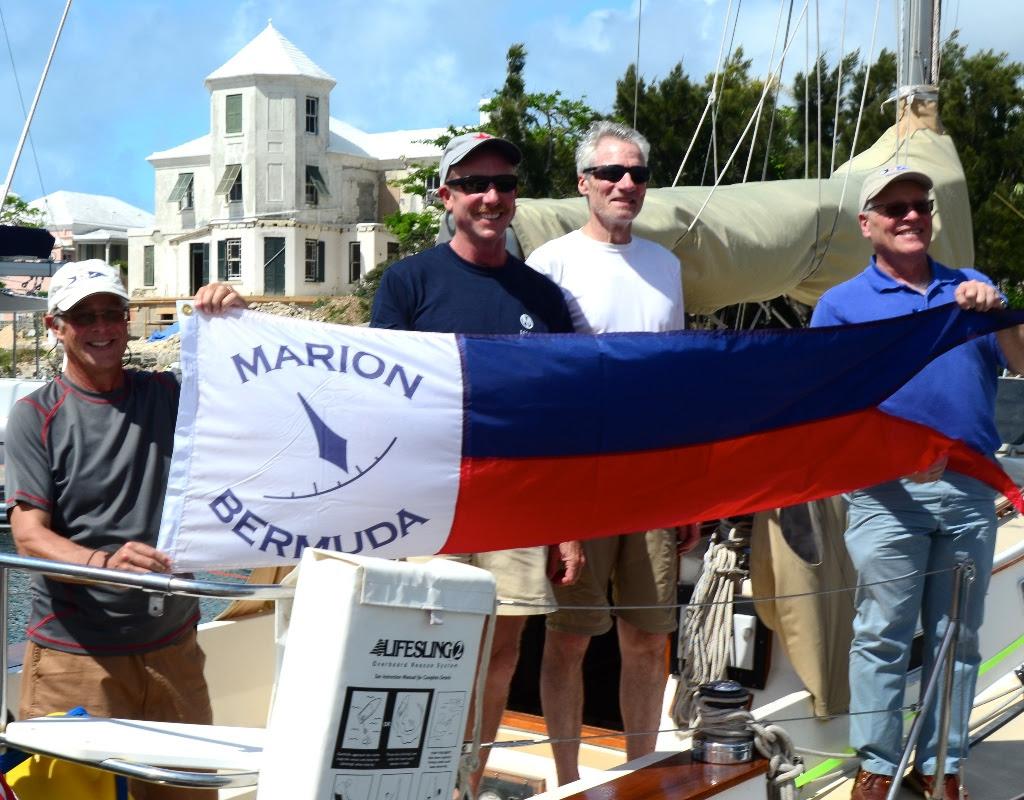 Dave Patton (L) Marion Bermuda Cruising Yacht Race Association  Chairman, and Wilie Forbes Vice Commodore of the Royal Hamilton Amateur Dinghy Club (Far Right) present the Winner's Banner to Chip Brandish (center left) skipper of 'Selkie' and Watch Captain George Dyroff. ‘Selkie’, Chip Bradish’s 1988 Morris Ocean 32.5 footer from Boston was the overall corrected time winner of Class D and the entire 40th Anniversary Marion Bermuda Race. © Talbot Wilson
