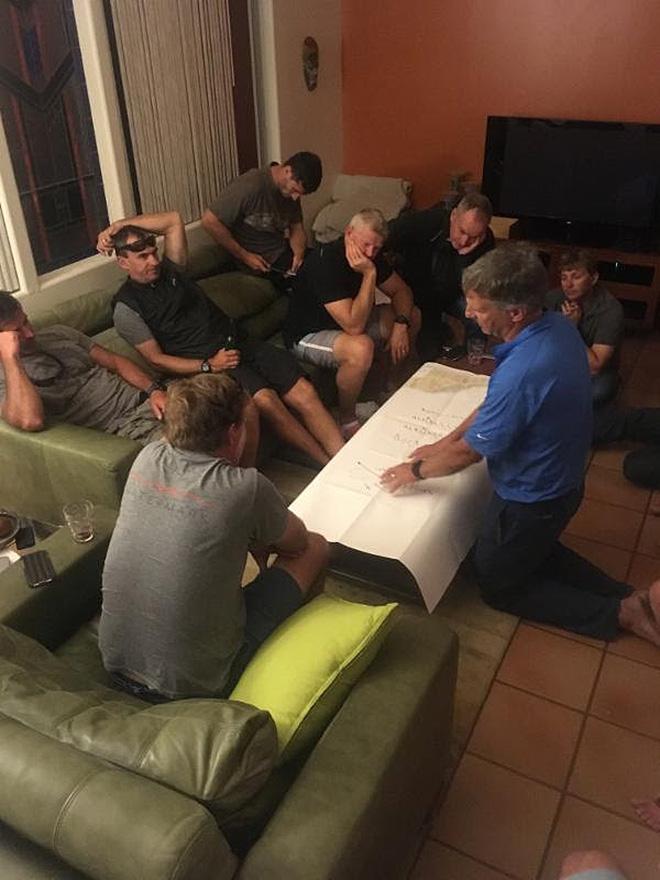 Comanche navigator Stan Honey briefing the crew on the team’s strategy prior to the start © Justin Clougher