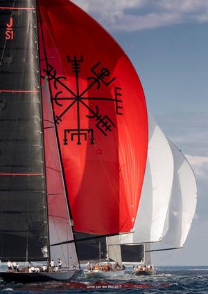JS1 Svea, with their distinctive red chute, chase the fleet downwind - Day 3 - J Class Worlds - Newport RI photo copyright Onne van der Wal taken at  and featuring the  class