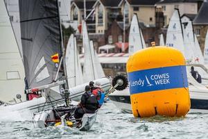 Smigger (Ian Smith) rounding a mark on a crowed Solent on Day 3 – SB20 Cowes Grand Slam photo copyright Jane Austin taken at  and featuring the  class