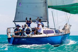 Librian crew waving off their competitors – SeaLink Magnetic Island Race Week photo copyright  Andrea Francolini / SMIRW taken at  and featuring the  class