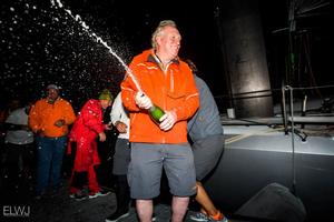 Rambler 88 crew celebrating their monohull line honours victory in the Rolex Fastnet Race photo copyright  Rolex / Carlo Borlenghi http://www.carloborlenghi.net taken at  and featuring the  class